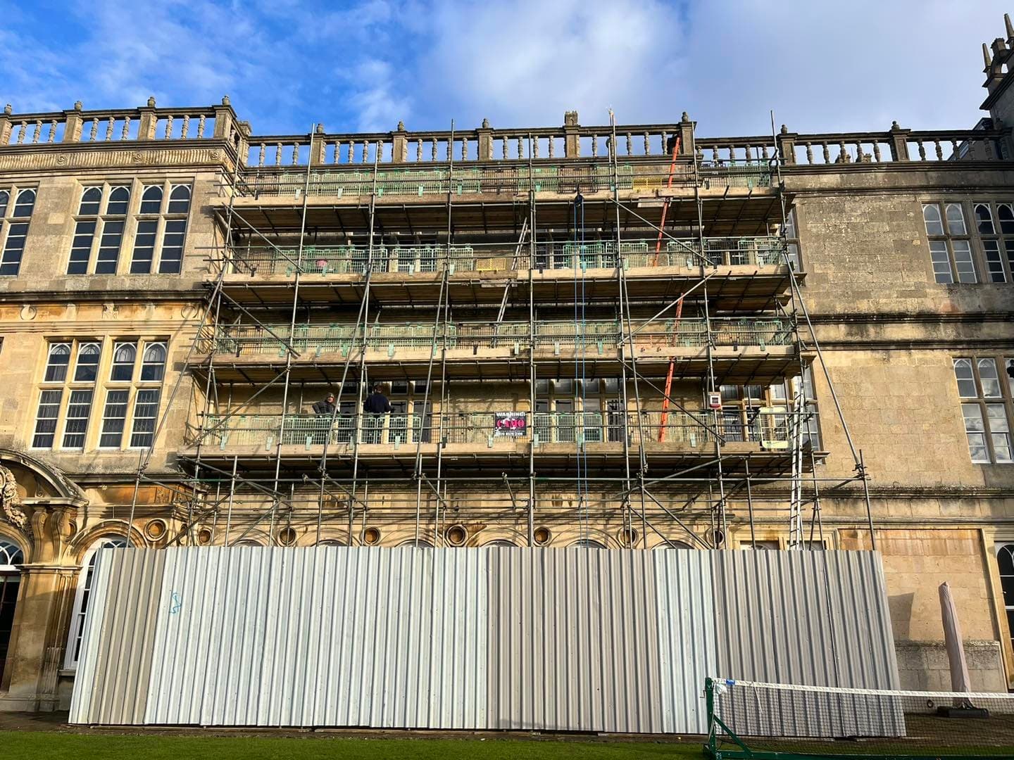 Scaffold in front of an ornate stone facade